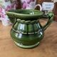 Green ceramic milk jug