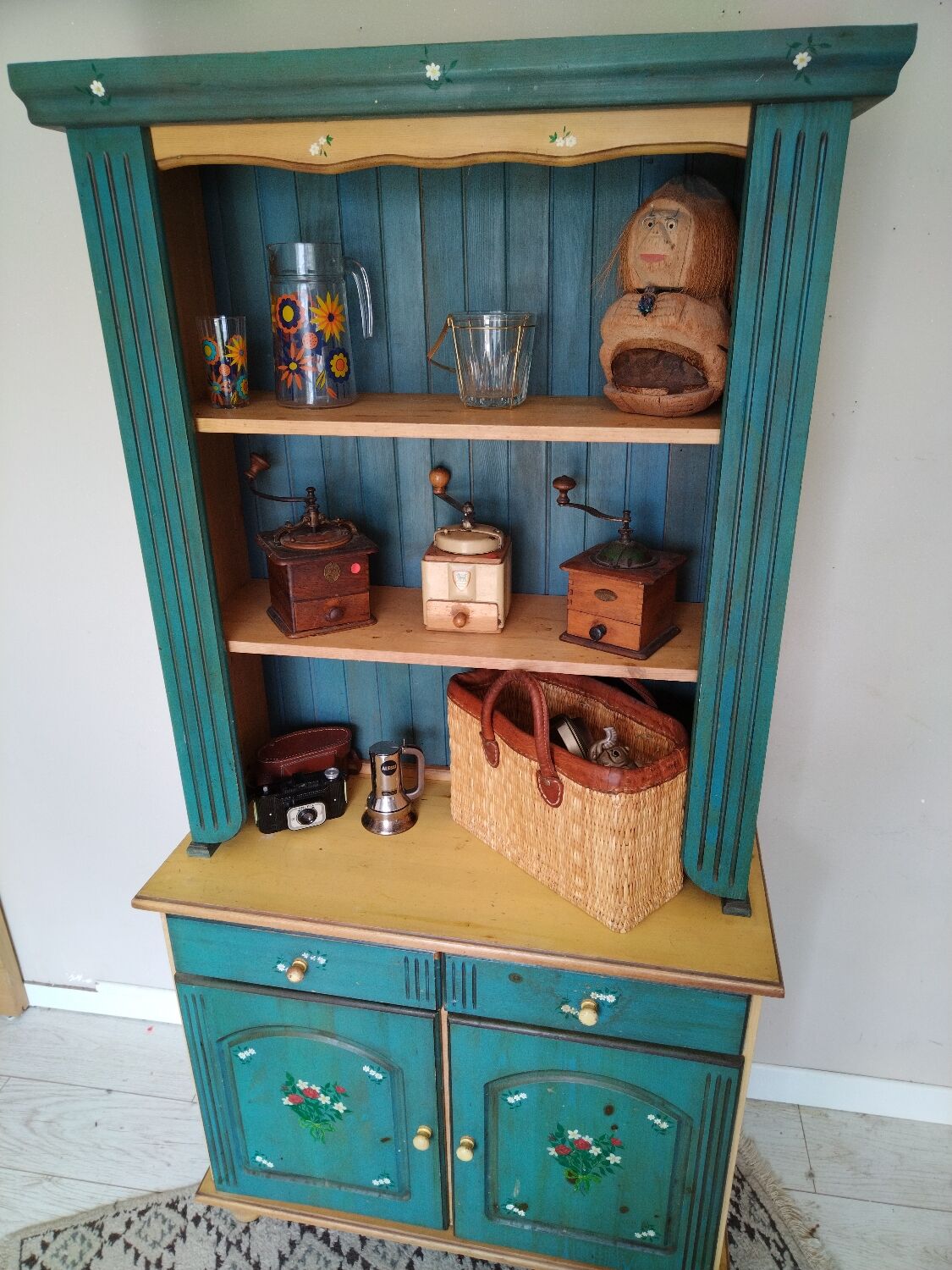 Rustic dresser with floral decor