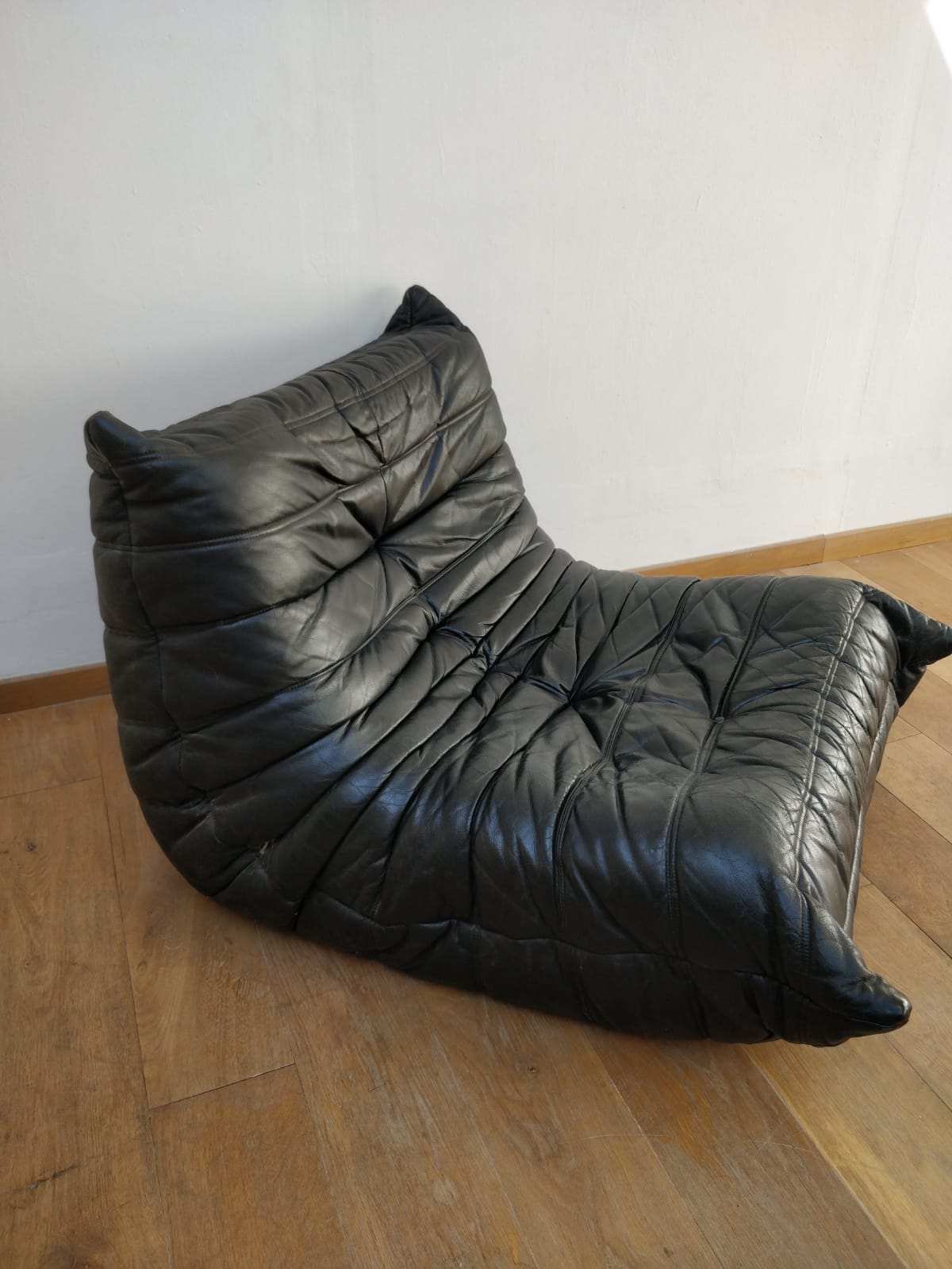 Togo in black leather by Ligne Roset