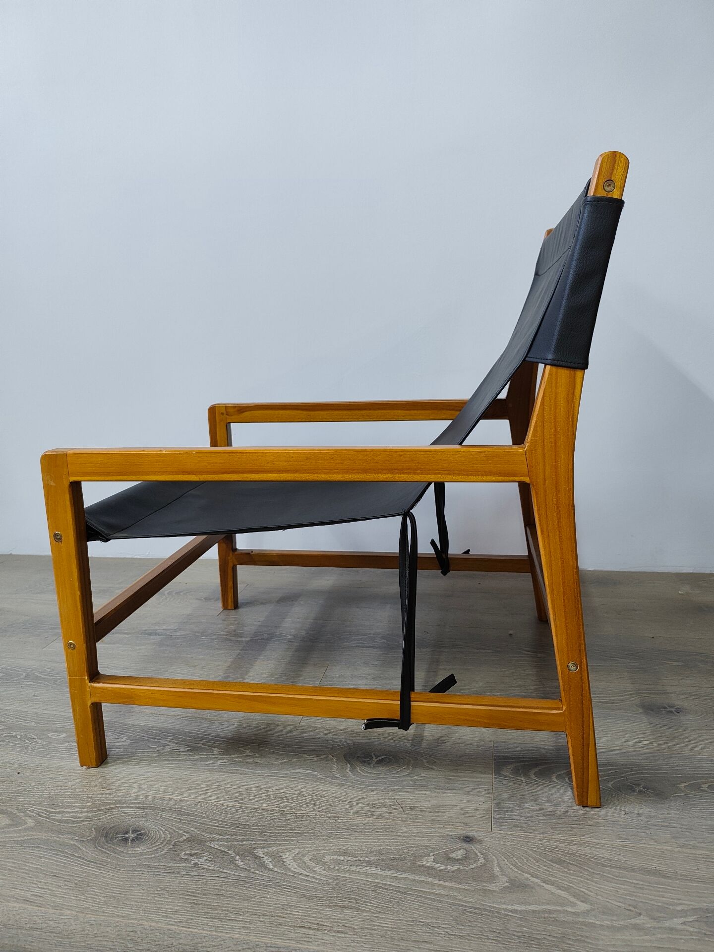 Leather and teak armchair