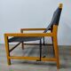 Leather and teak armchair