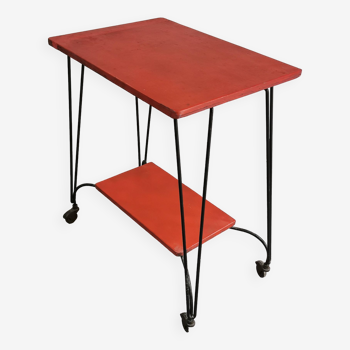 Vintage red serving table on wheels from the 1950s.