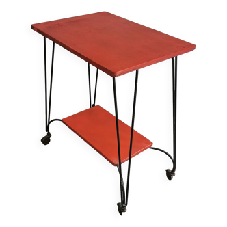 Vintage red serving table on wheels from the 1950s.