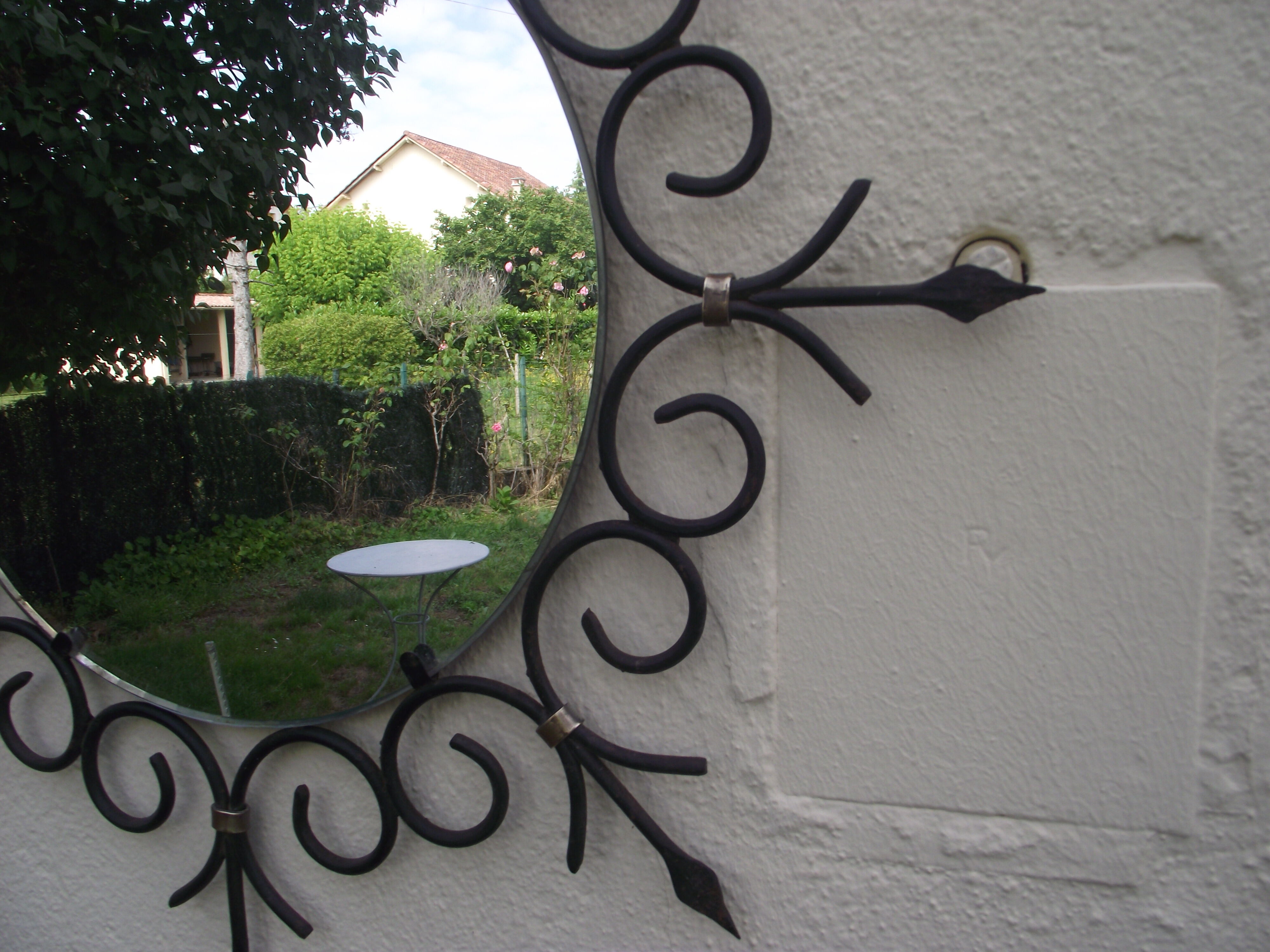 Mirror sun of the 50s in wrought iron and brass 55cm