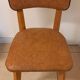 Set of 4 vintage chairs in solid beech and caramel faux leather.