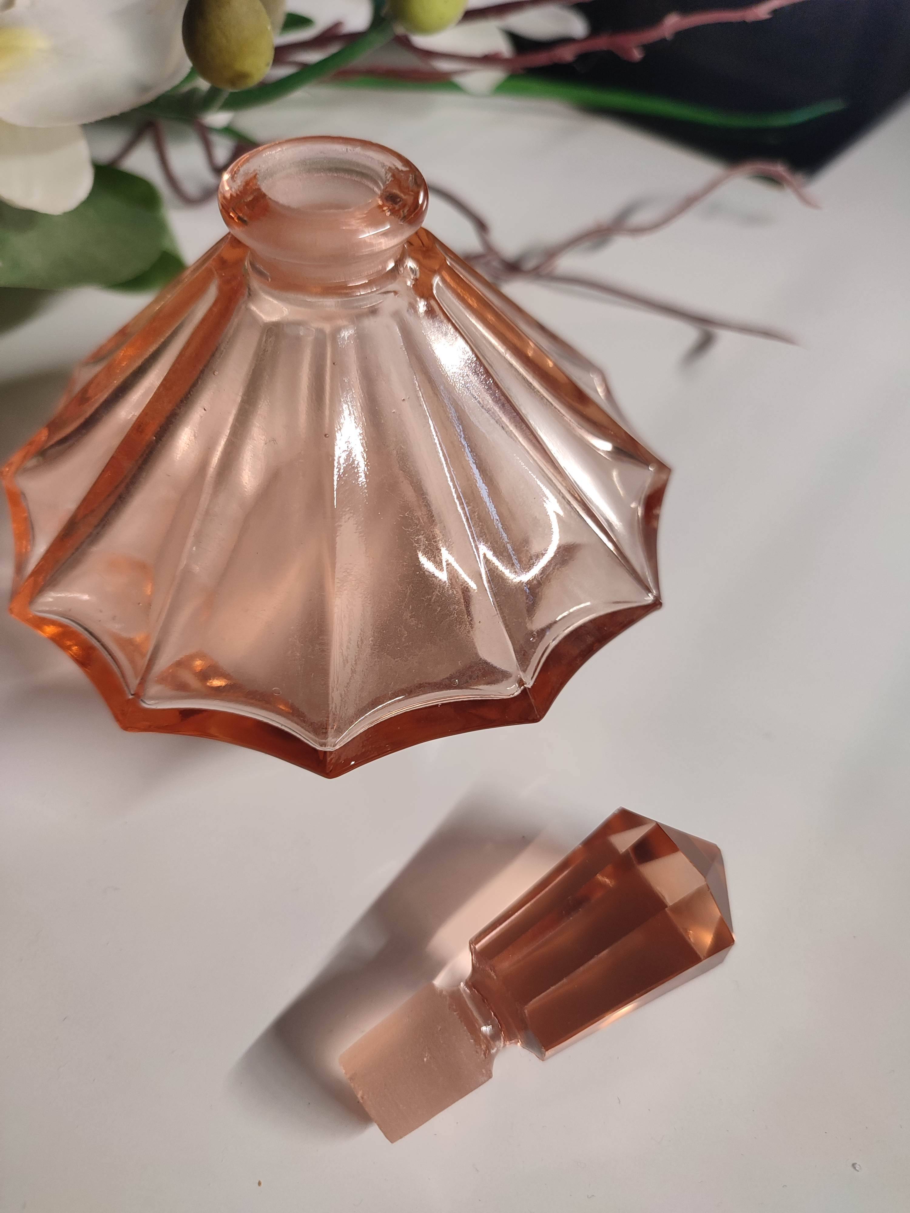 Vintage Art Deco perfume bottle in beautiful pink glass.