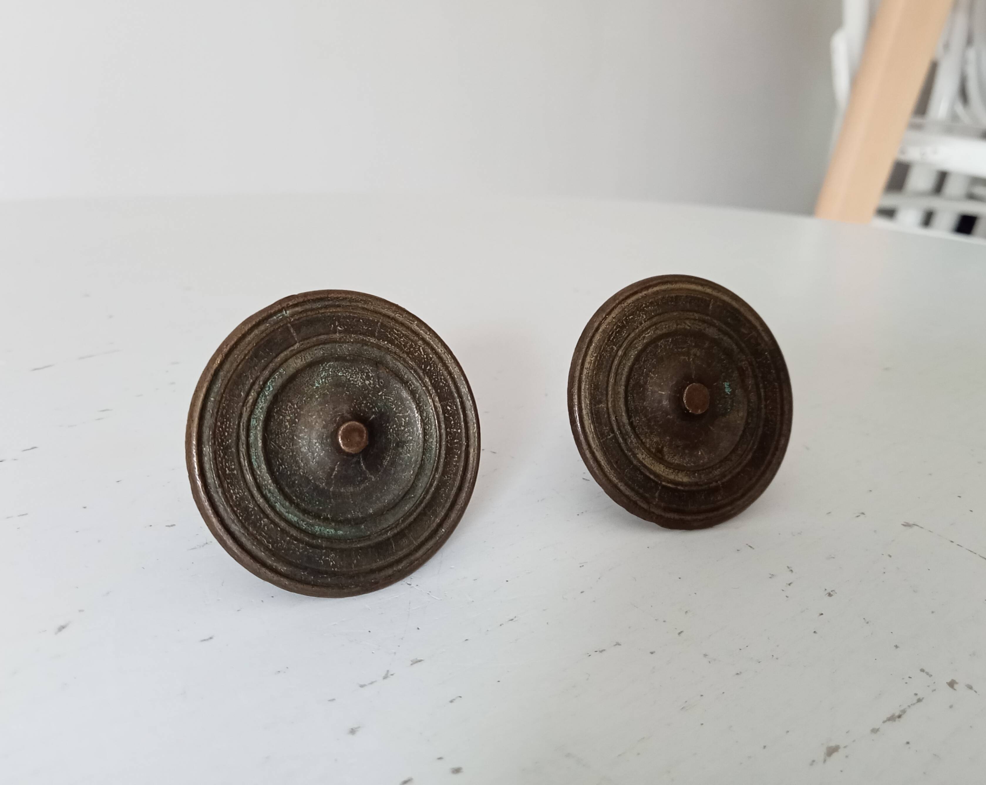 Pair of antique Empire furniture knobs from the 19th century.