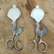Set of two pairs of antique eggcutter scissors