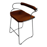 Contemporary organic bar stool with a smoked black metal backrest and cognac leather.