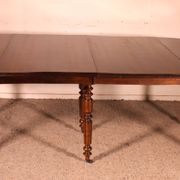Table de salle à manger extensible du début du 19° siècle en noyer