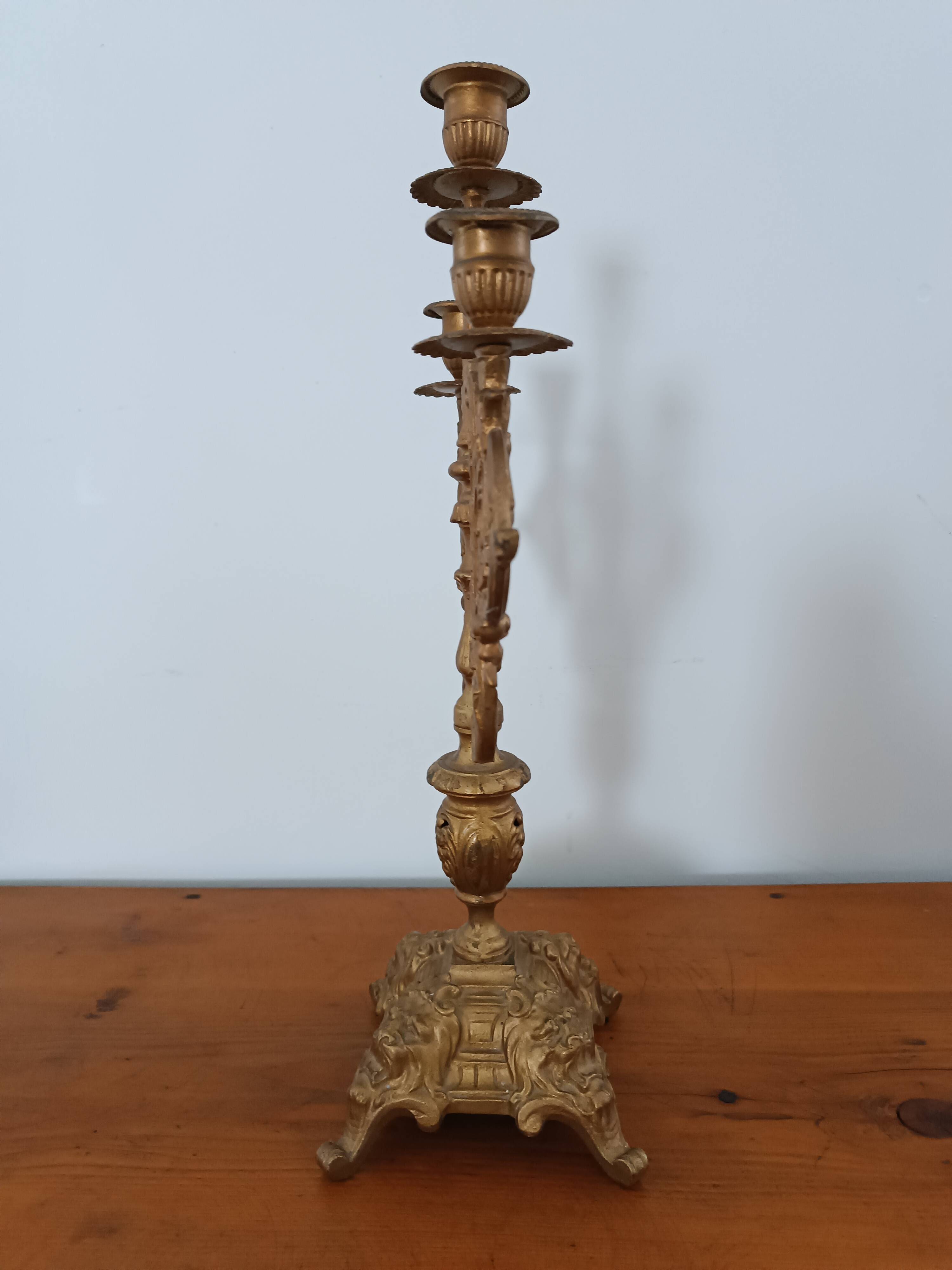 Bronze candlestick with lion head decoration