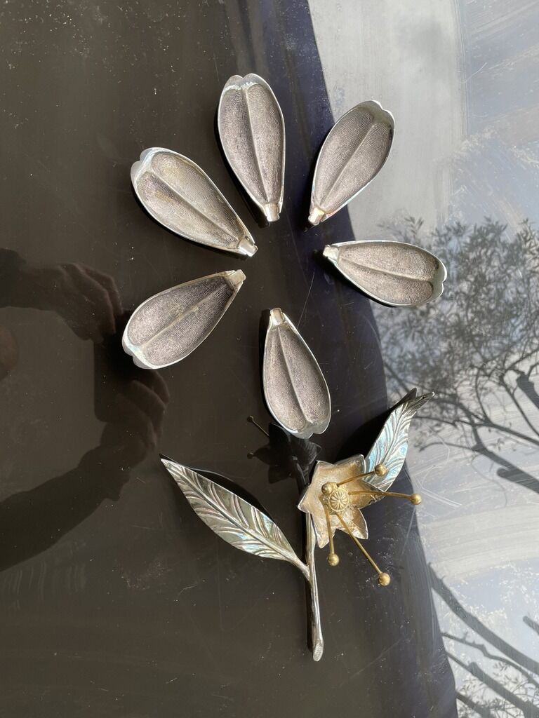 Silver metal flower with cup petal