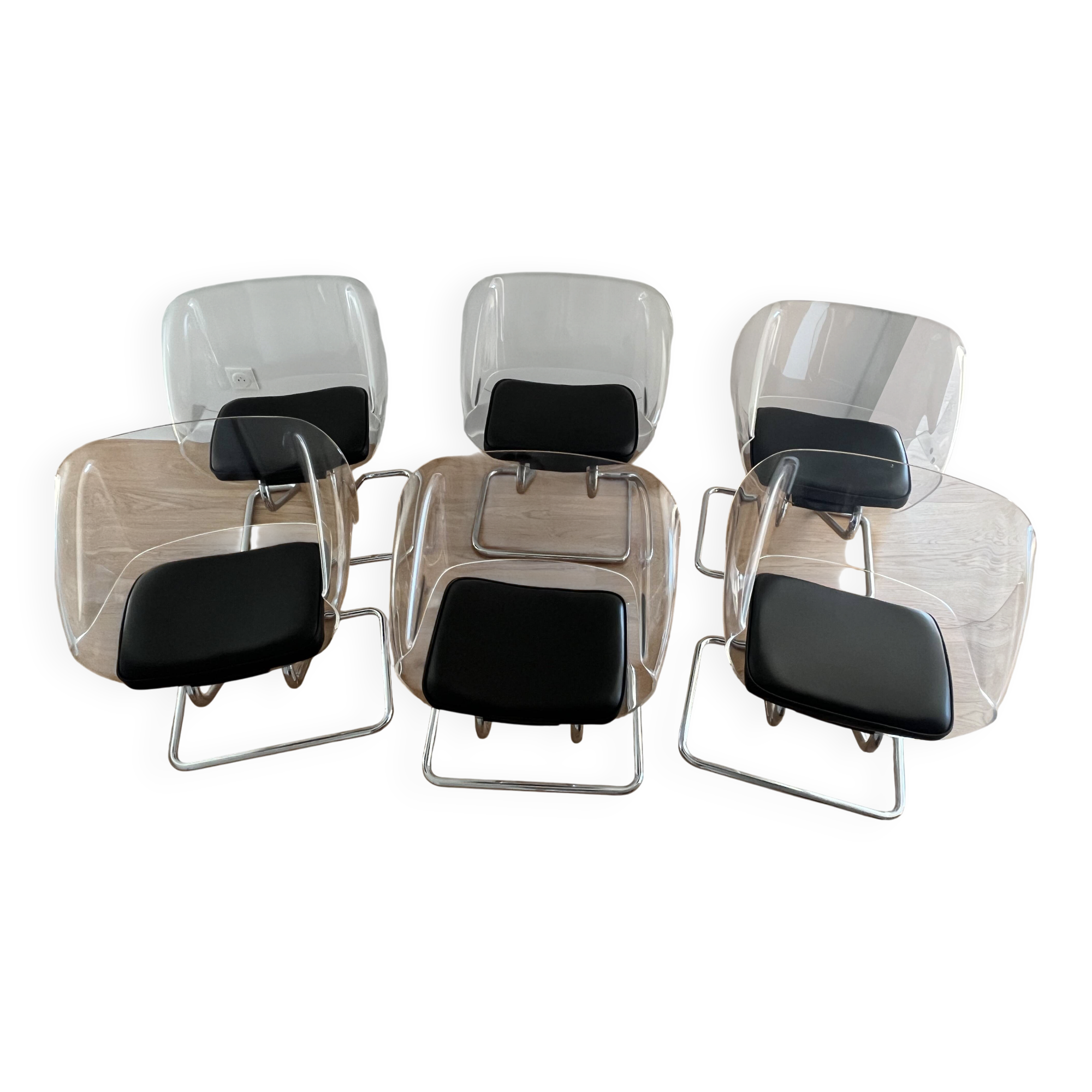1970s chairs in acrylic and metal designed by Harvey Guzzini.