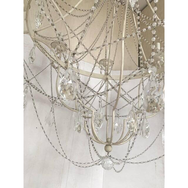 Contemporary ivory florentine iron and crystals chandelier