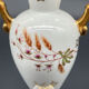 Small amphora vase in Limoges porcelain with gilded handles.
