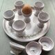Egg cups, 9-piece service by Michel Spire