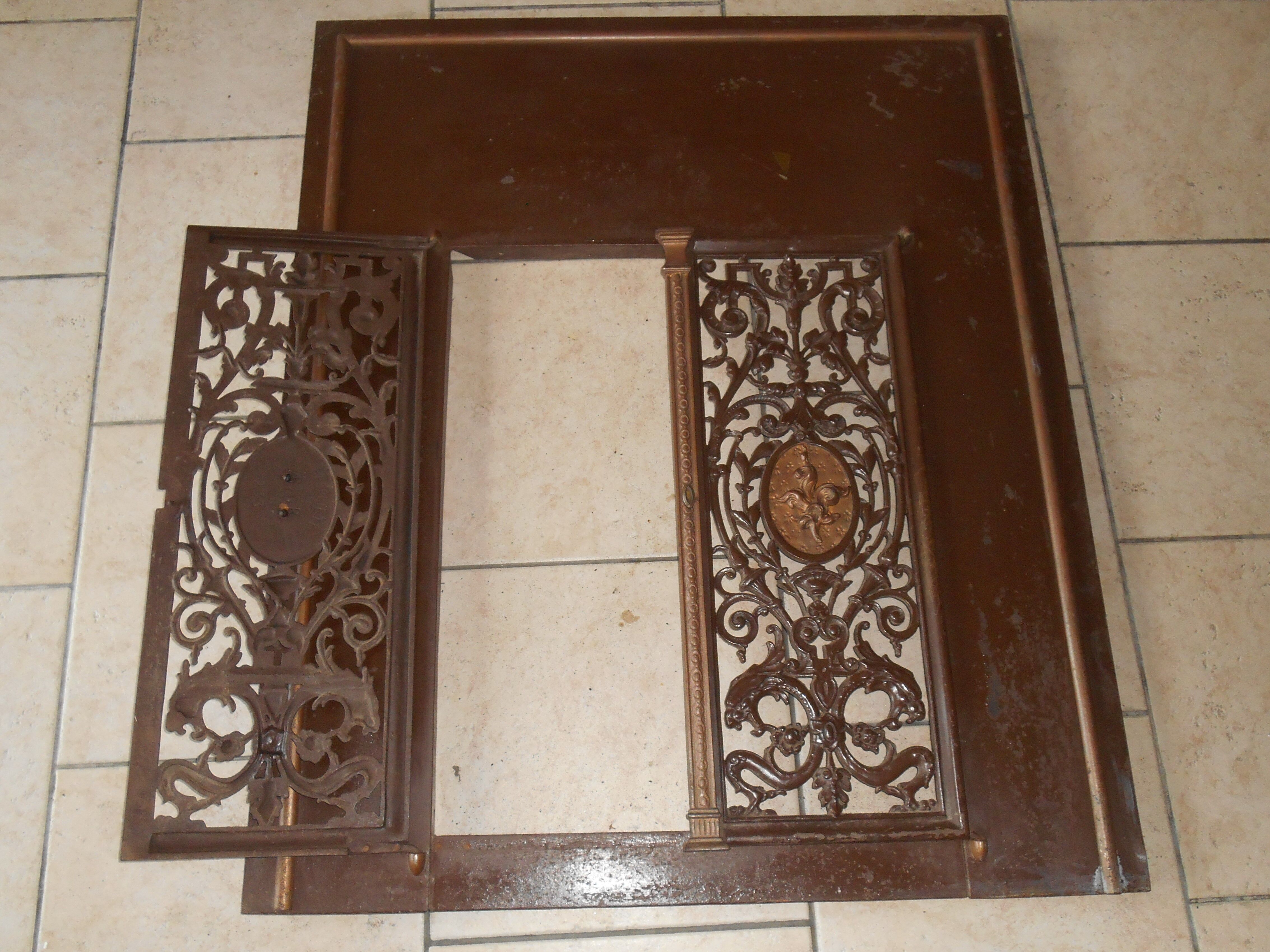 Pair of cast iron door grilles with its coat