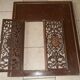 Pair of cast iron door grilles with its coat