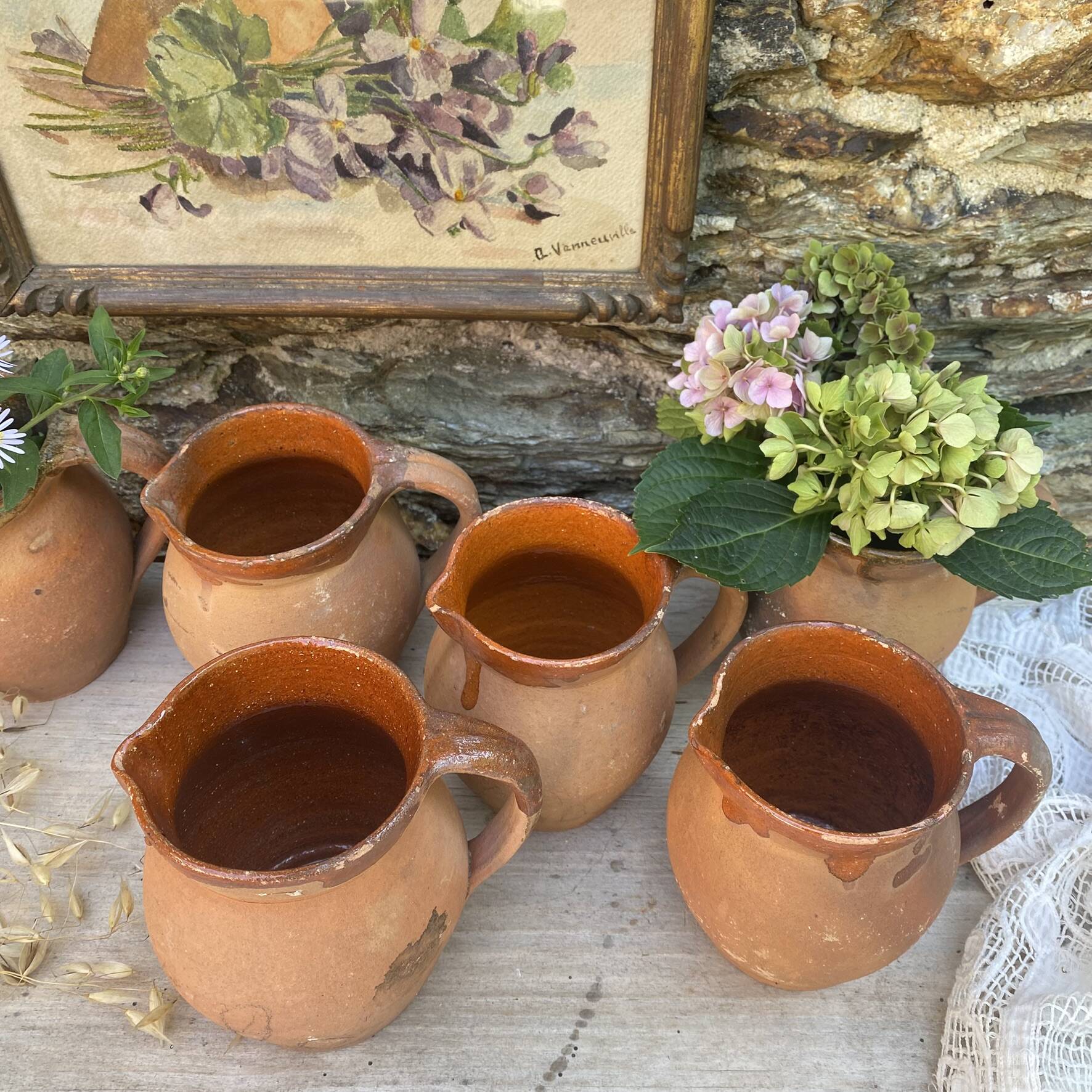 set of terracotta jugs country style
