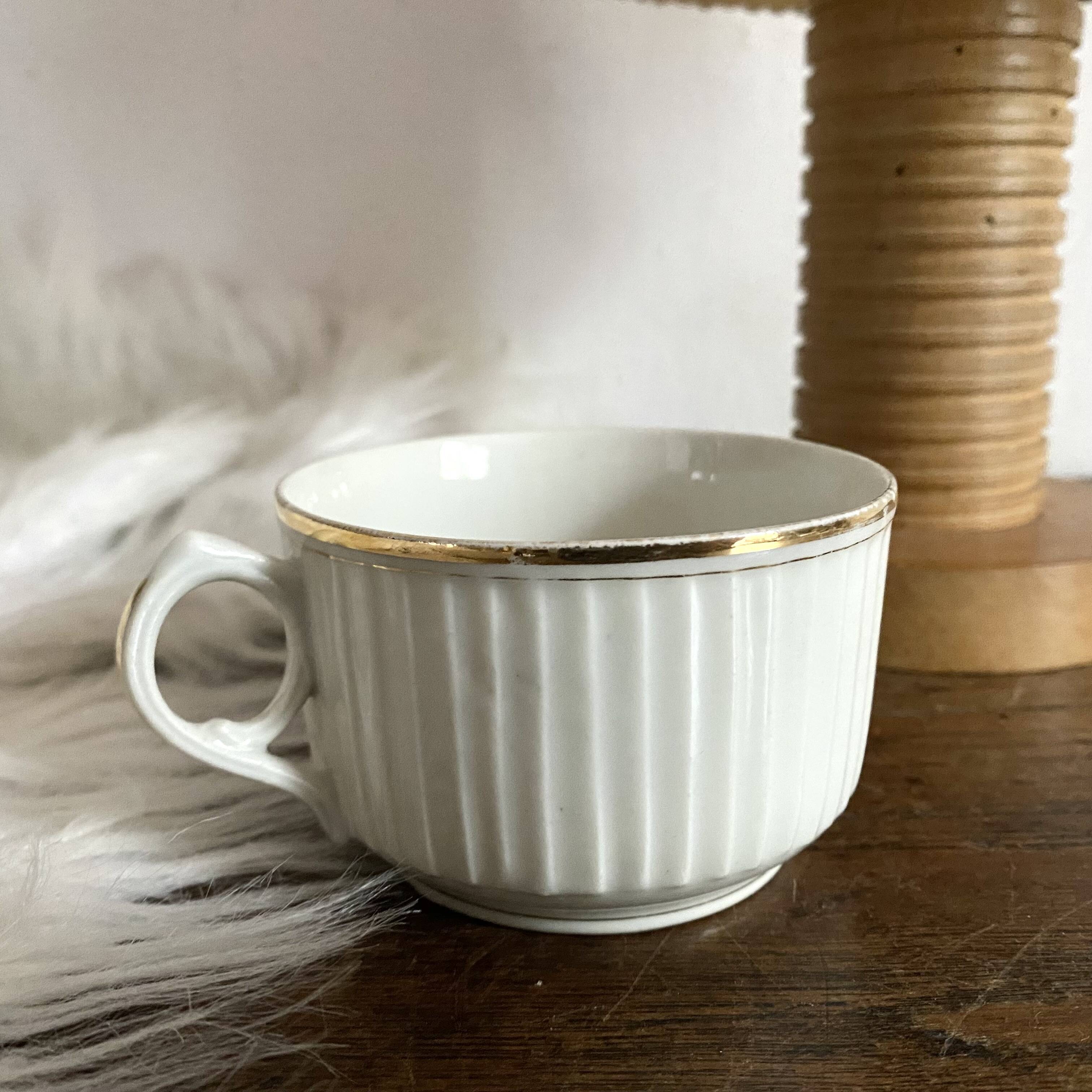 White and gold porcelain cups