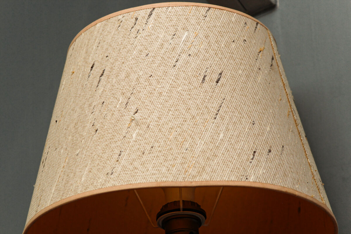 Carved wooden lamp, fiber shade
