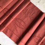 Old linen and cotton sheet in brick red