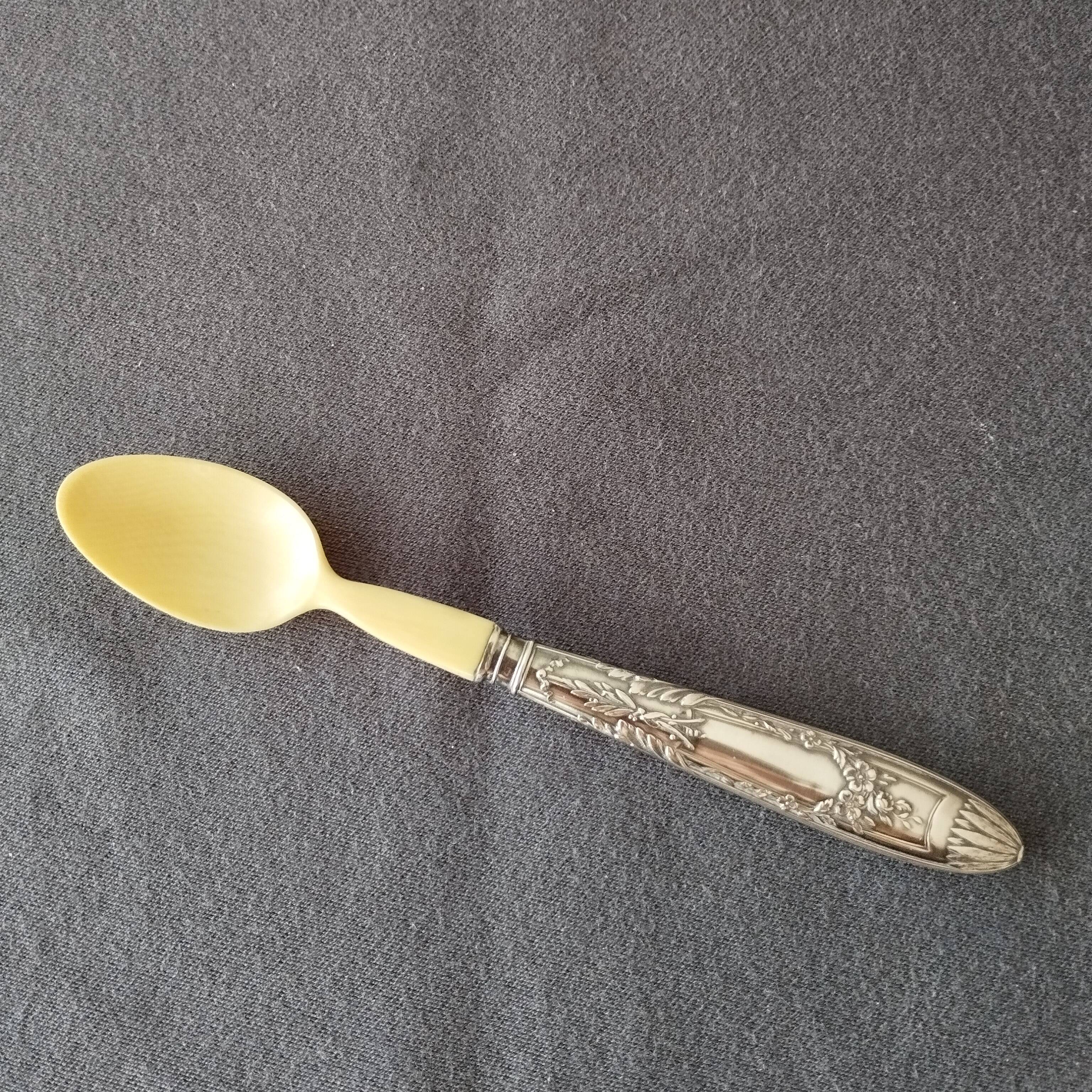 silver-plated baby feeding spoon