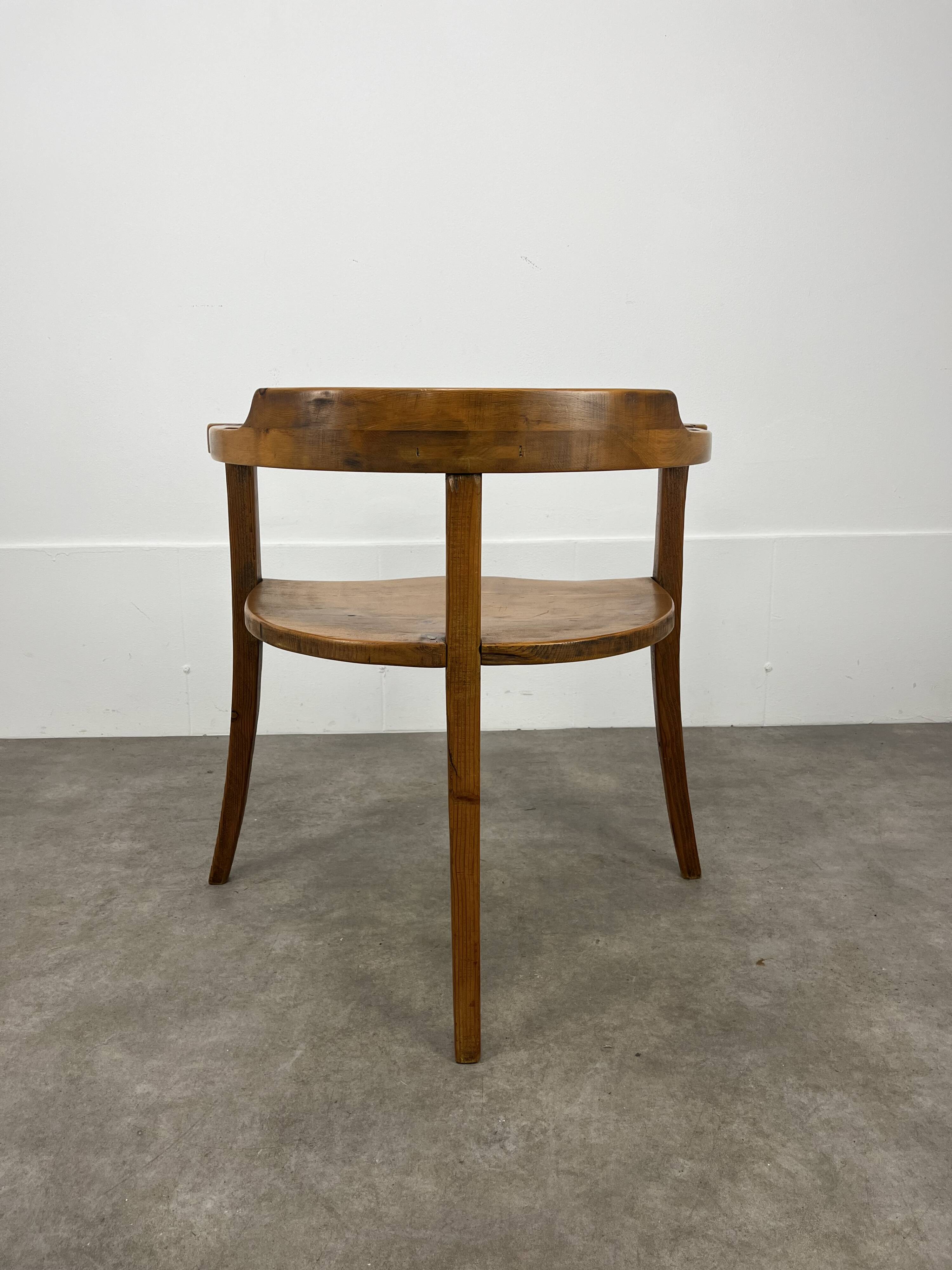 Chalet-style carved wooden tripod armchair