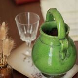 Old ceramic enamelled pitcher vase