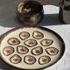 Large circular platter with compartments for shellfish, molluscs, and oysters.