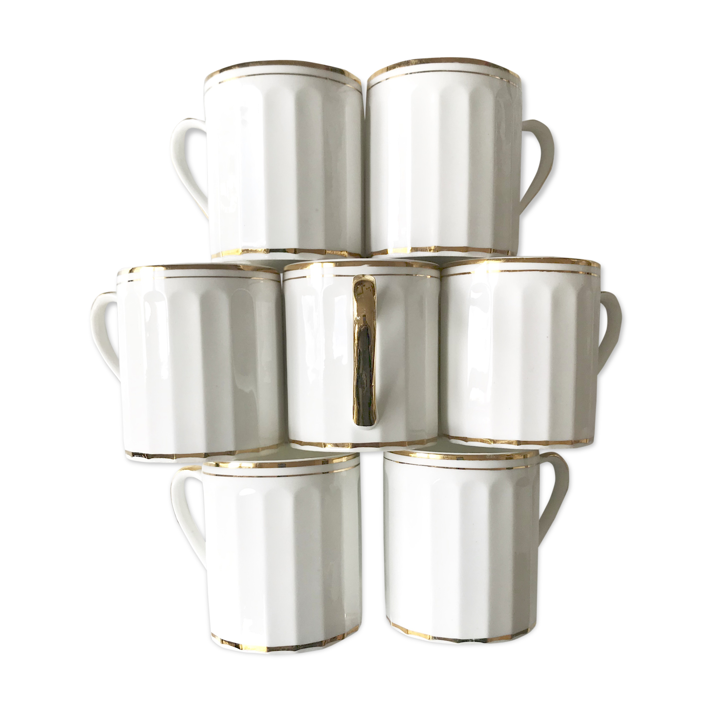 Set of 7  cups in white and gold porcelain