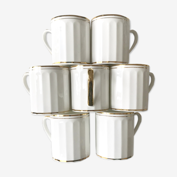 Set of 7  cups in white and gold porcelain