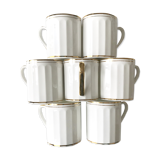 Set of 7  cups in white and gold porcelain