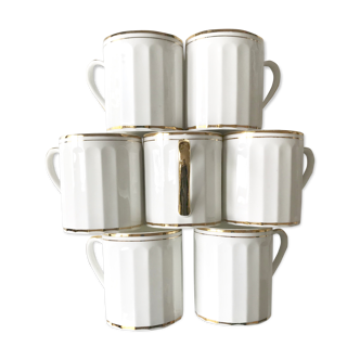 Set of 7  cups in white and gold porcelain