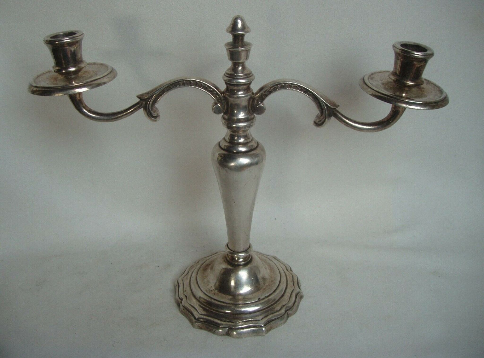 Two-branch silver-plated candle holder from the early twentieth century.