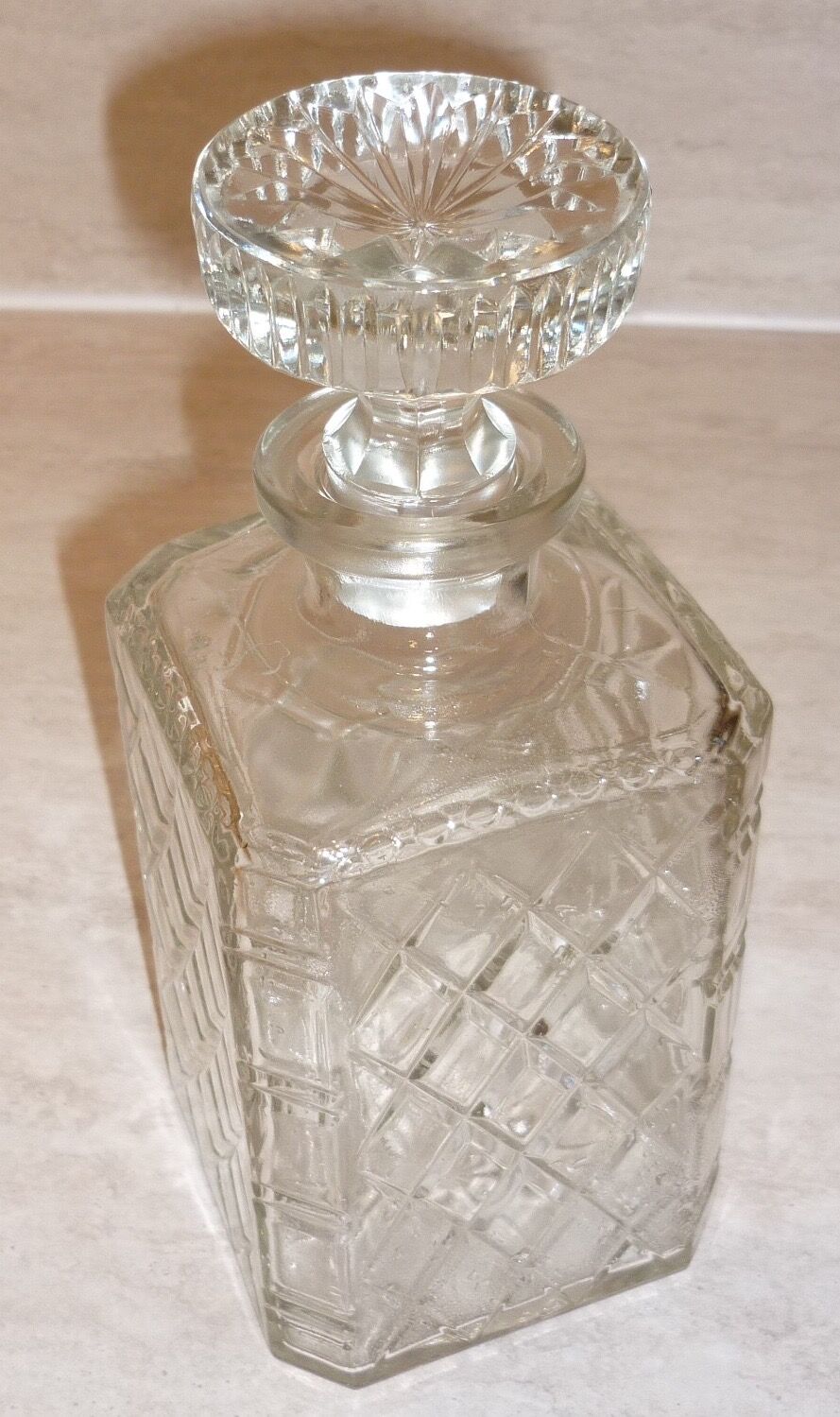 Antique whisky decanter made of chiseled glass