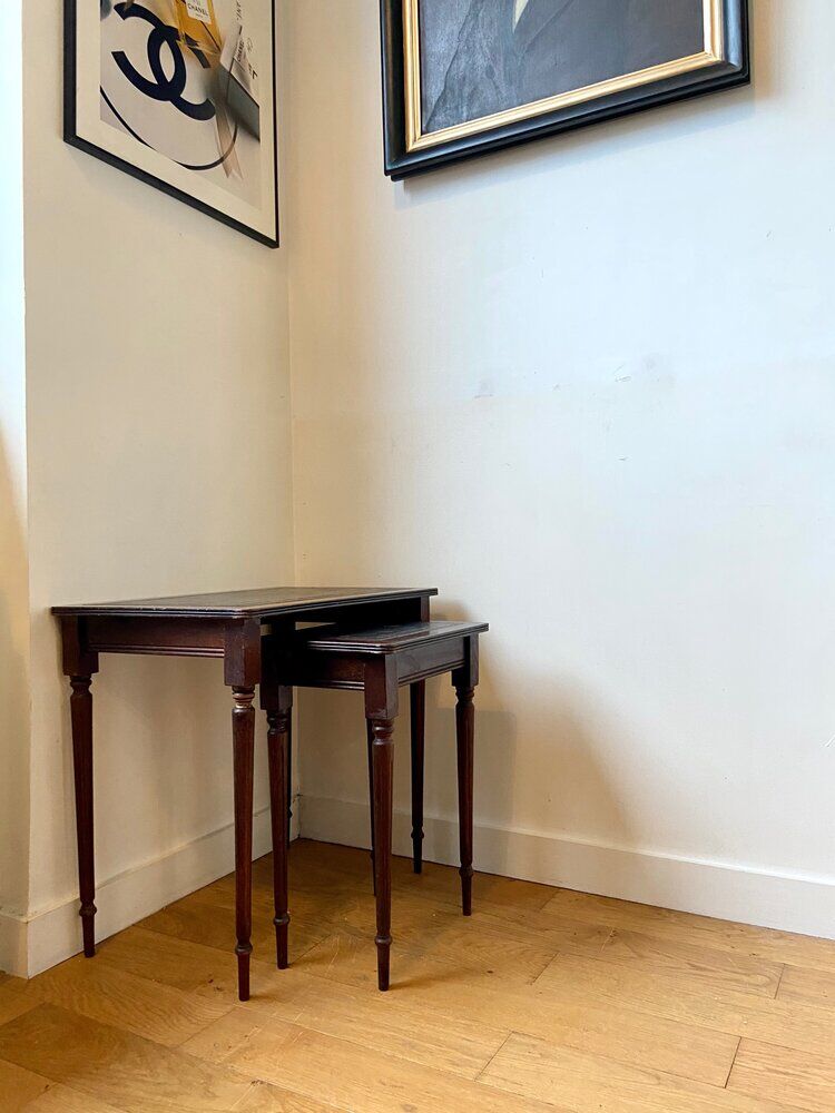 Dark wood and black leather tables