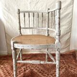 19th-century corner fireplace armchair, wood and cane.