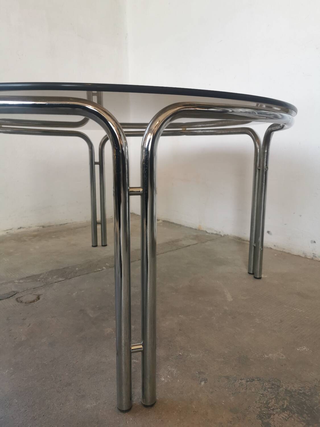 Round chrome and smoked glass coffee table