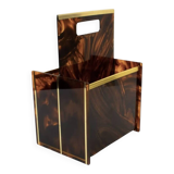 Tortoiseshell lucite magazine rack from the Christian Dior Home collection.