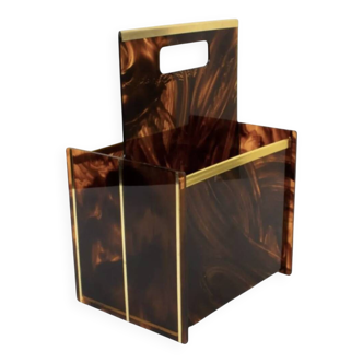 Tortoiseshell lucite magazine rack from the Christian Dior Home collection.