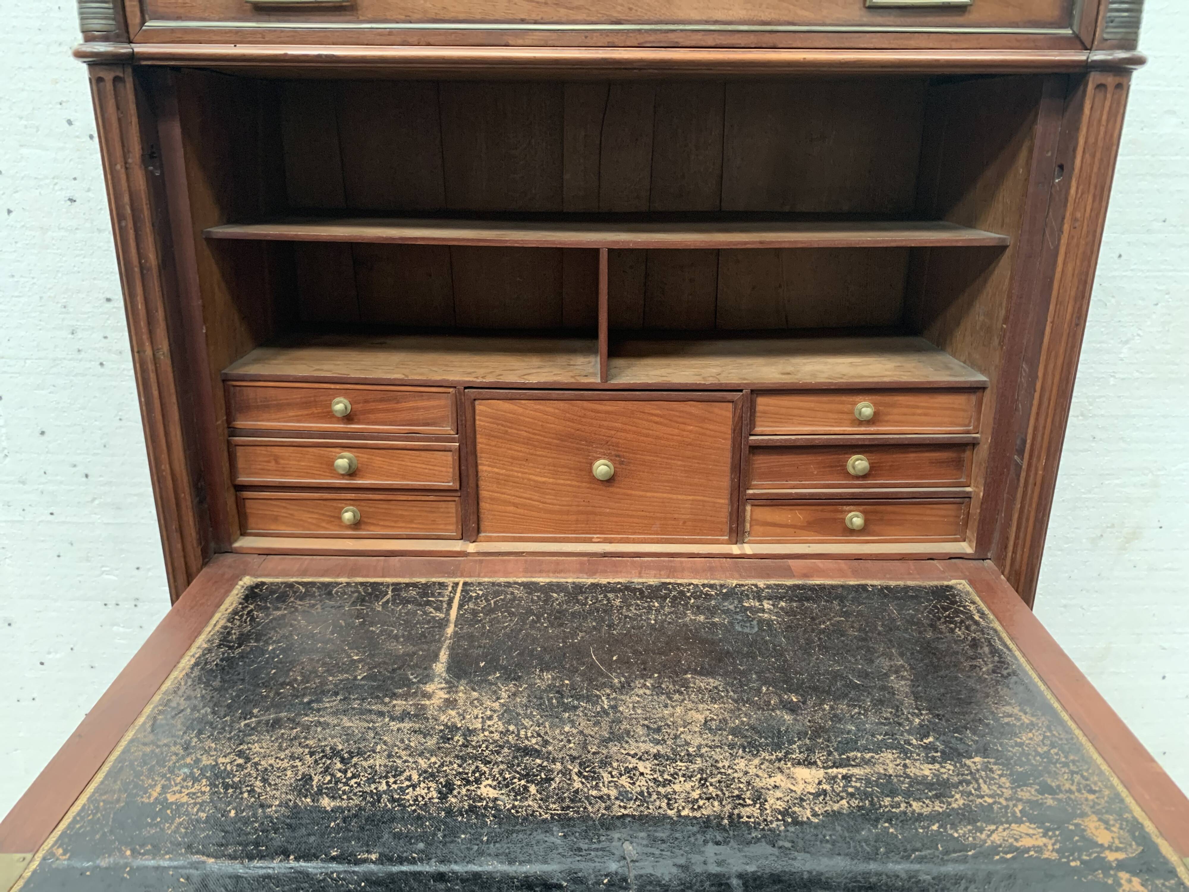 Secretary Louis XVI in mahogany Top of veined gray marble XIX century