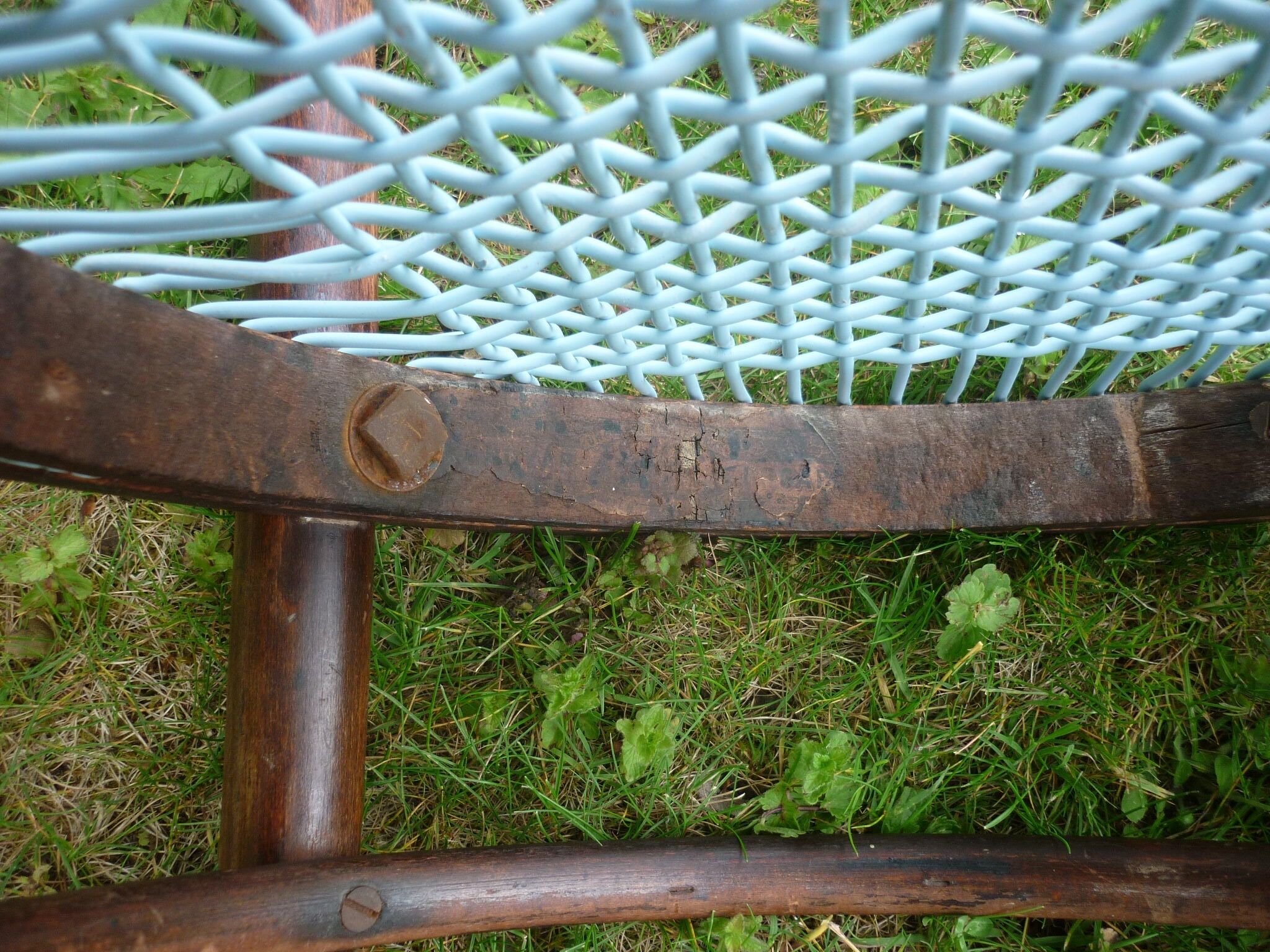 Chair with blue wire braided seat