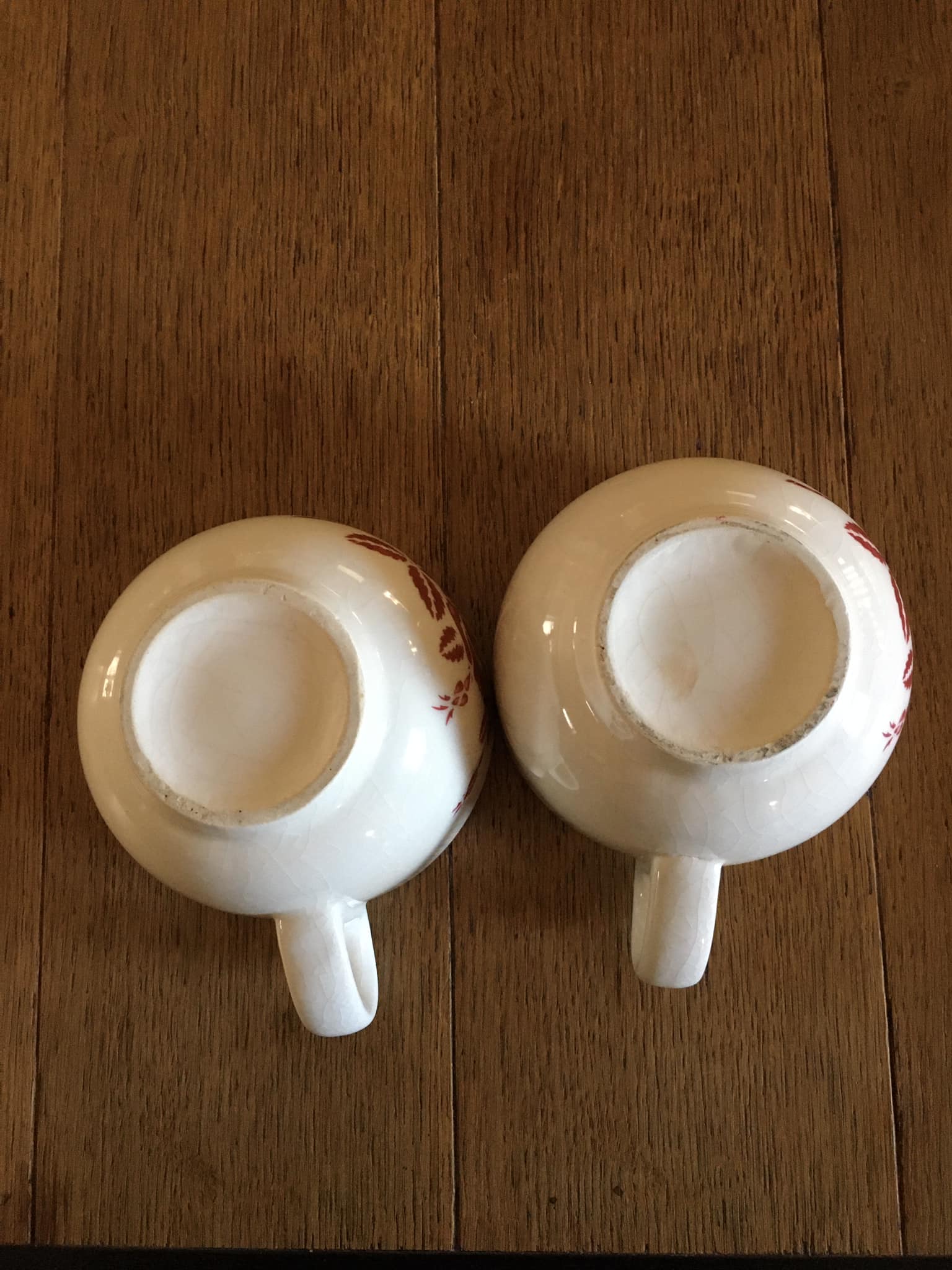 2 antique earthenware cups, red flower motifs