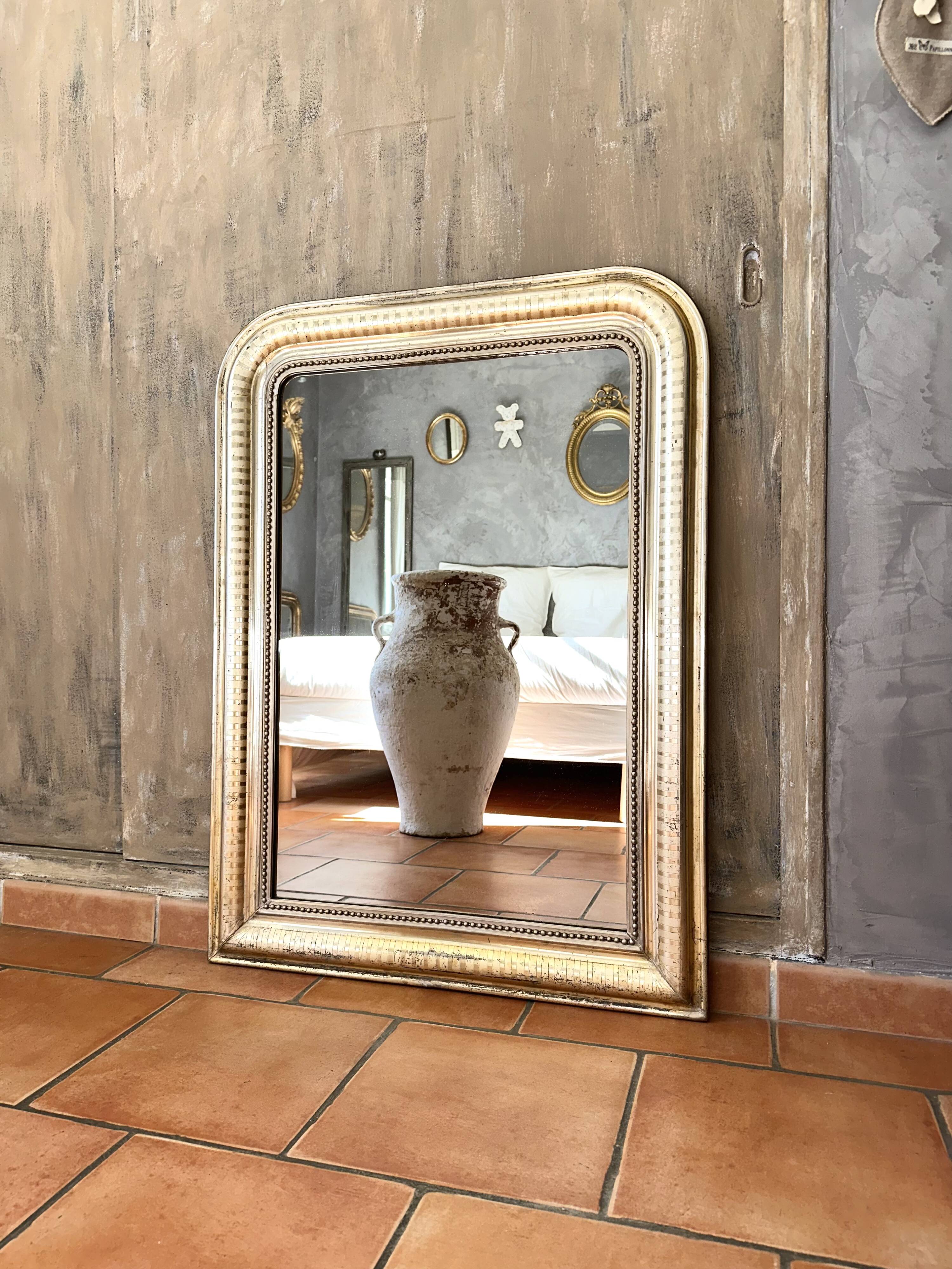 Louis-Philippe antique mirror with silver leaf, 19th century.