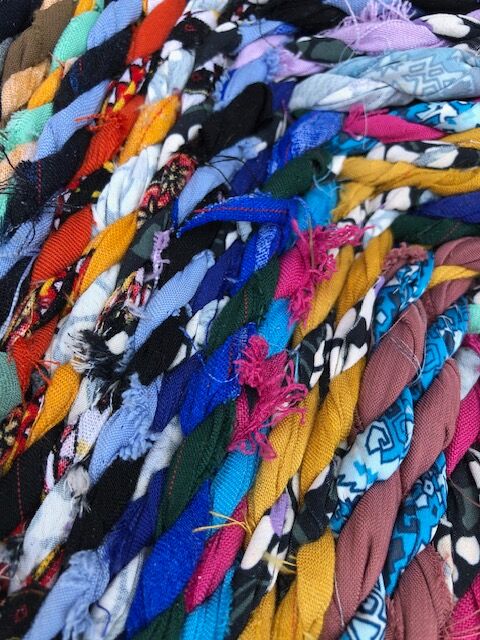 Wooden armchair braiding multicolored fabrics