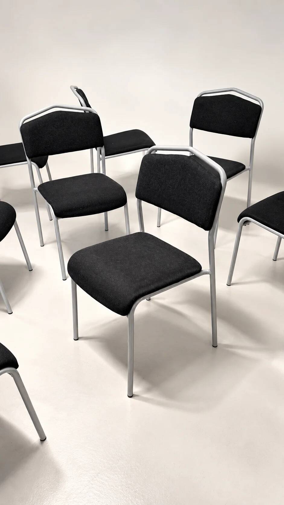 Grey steel chair and black fabric