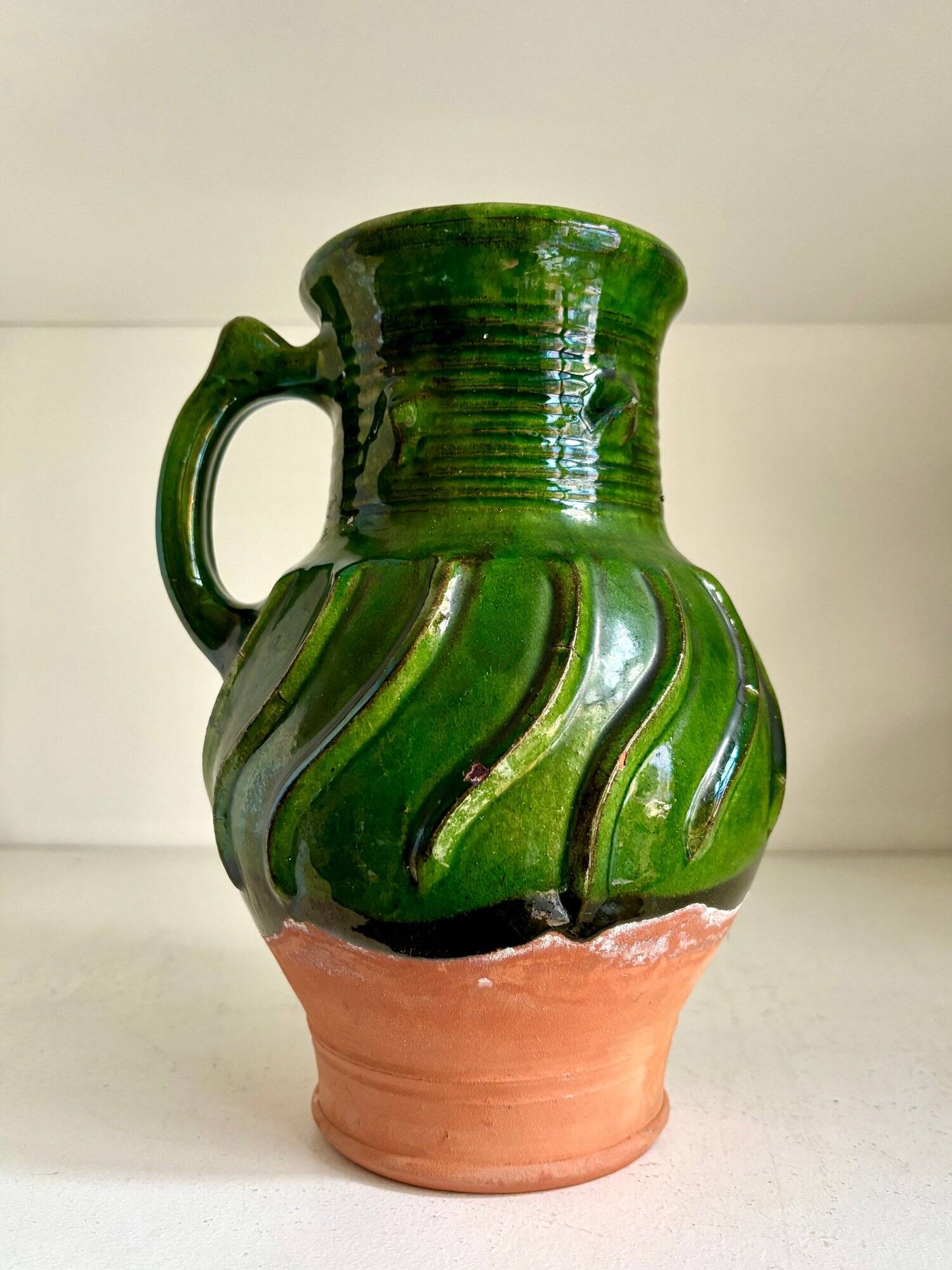 Green glazed terracotta pitcher
