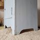 Handcrafted blue chest of drawers.