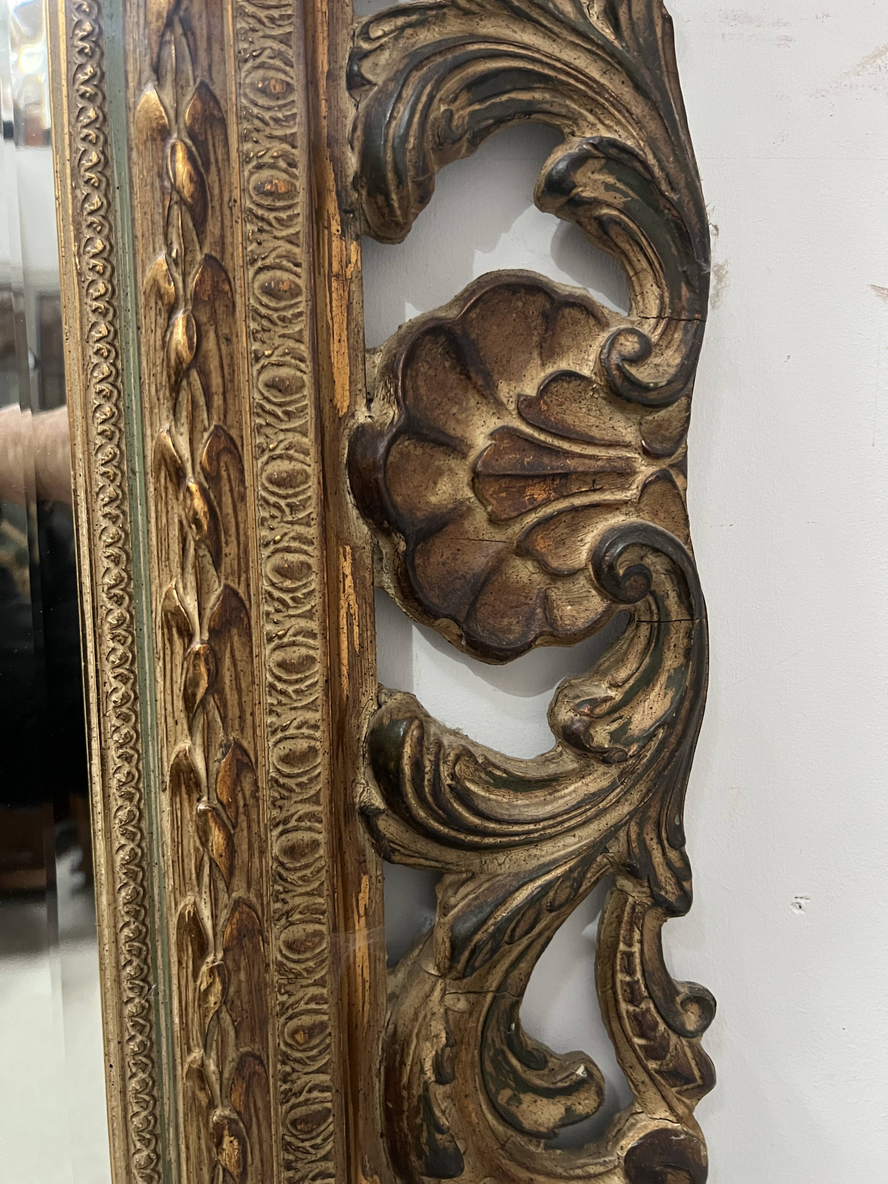 Napoleon III style mirror in carved wood, 20th century.
